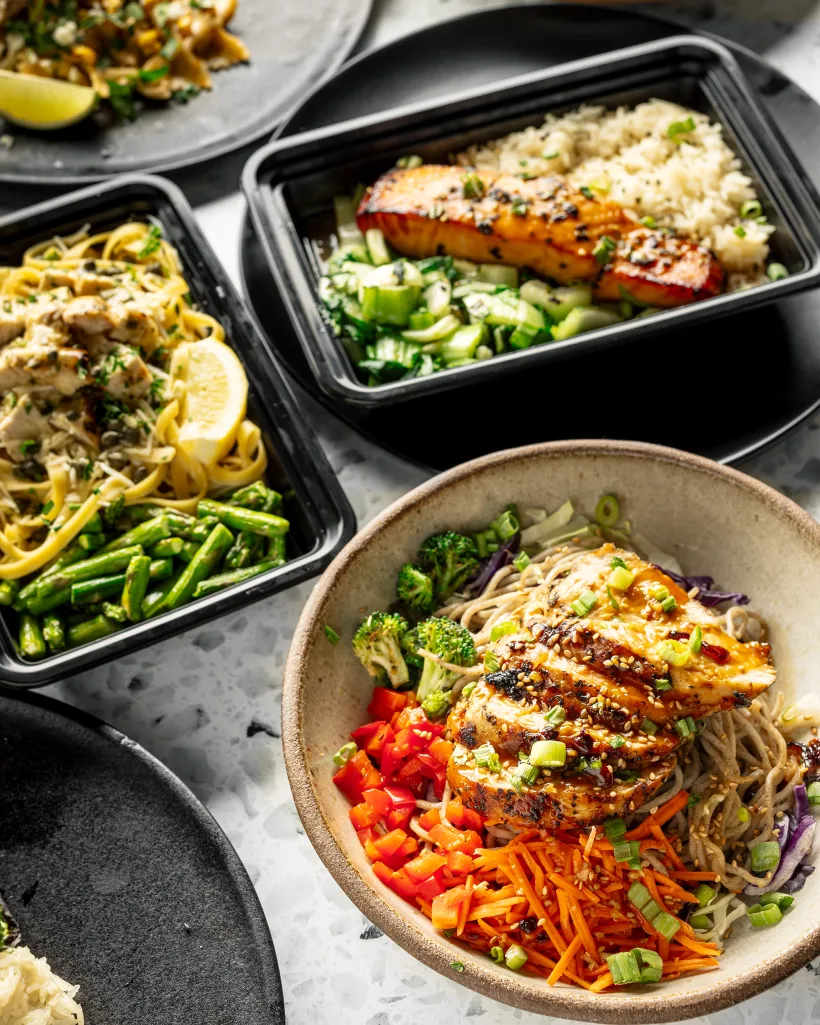 A spread of fresh MHP meal-prep dishes ready for the workplace